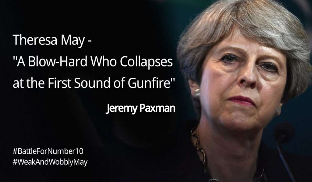 Photo of a grim-faced Theresa May captioned with a quote from Jeremy Paxman: A blow-hard who collapses at the first sound of gunfire.